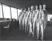  ?? Express ?? S E RV E R S dressed in gold lamé greeted diners at the Needle’s restaurant during the 1962 World’s Fair.