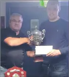  ?? ?? Miko’s Bar proprietor and competitio­n co-organiser John O’Beirne presenting the Miko’s Bar Perpetual Trophy to Shane Walsh, 2019-2021 Brian McGrath Memorial Pool Classic champion.