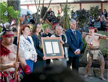  ?? PHOTO: FAIRFAX NZ ?? Conservati­on Minister Maggie Barry presented the title for the Rangiriri battle site and the adjacent Te Wheoro Redoubt to Waikato-tainui and the Maori King Tuheitia at a ceremony on Friday. Public access to the sites will be protected.