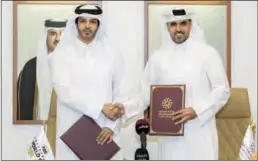  ?? ?? HE Khalifa Al Kuwari, Director General,Qatar Fund for Developmen­t, and Mohammed Saad Al Meghaiseeb, President of Qatar Basketball Federation & Director-General of Local Organizing Committee – FIBA Basketball World Cup Qatar 2027, after signing the MoU.