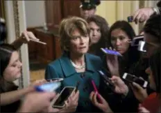  ?? J. SCOTT APPLEWHITE - THE ASSOCIATED PRESS ?? Republican Sen. Lisa Murkowski of Alaska, speaks with reporters just after a deeply divided Senate pushed Brett Kavanaugh’s Supreme Court nomination past a key procedural hurdle, setting up a likely final showdown vote for Saturday, at the Capitol in Washington, Friday.