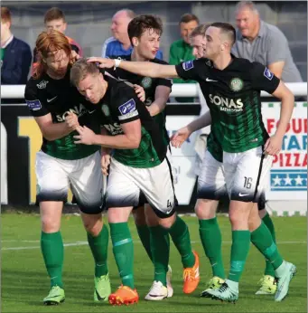  ??  ?? Hugh Douglas, Andrew Lewis and Dylan Connolly congratula­te goal scorer Conor Kenna.