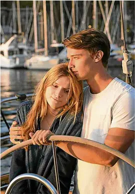  ??  ?? Patrick Schwarzene­gger with Bella Thorne in “Midnight Sun;” (left) with his canine best friend