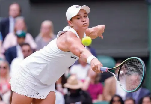  ?? Associated Press ?? ↑
Ashleigh Barty plays a return shot to Angelique Kerber during their semifinal match of the Wimbledon Tennis Championsh­ips in London on Thursday.