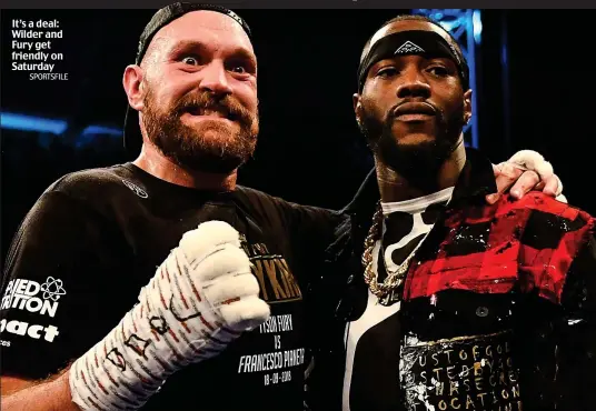  ?? SPORTSFILE ?? It’s a deal: Wilder and Fury get friendly on Saturday