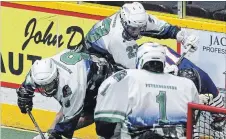  ?? CLIFFORD SKARSTEDT EXAMINER ?? Peterborou­gh MinCom Kawartha Lakes Realty Jr. C Lakers’ Kyle Nelson (8) and teammate Nate Allen force a turnover against Whitby Warriors’ Owen Agnew during Game 2 of the OJCLL Eastern Conference finals at the Memorial Centre on Friday night.