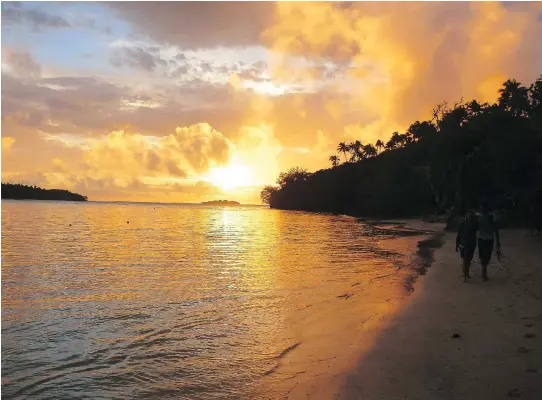  ?? BRIANNA RANDALL/FOR THE WASHINGTON POST ?? A leisurely sunset walk along Ofu island beach magically combines beautiful scenery and a relaxing atmosphere.