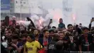  ??  ?? Crowds of PSG supporters chanted and set off smoke flares in celebratio­n of Messi's arrival