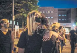  ?? CHANDAN KHANNA AFP VIA GETTY IMAGES ?? Protesters gather on Wednesday in Atlanta, five days after Rayshard Brooks was shot dead by police in the parking lot of a Wendy’s restaurant.