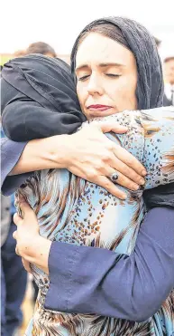  ?? PHOTO: GETTY ?? Solidarity: New Zealand Prime Minister Jacinda Ardern hugs a woman during a visit to the Kilbirnie Mosque in Wellington.
