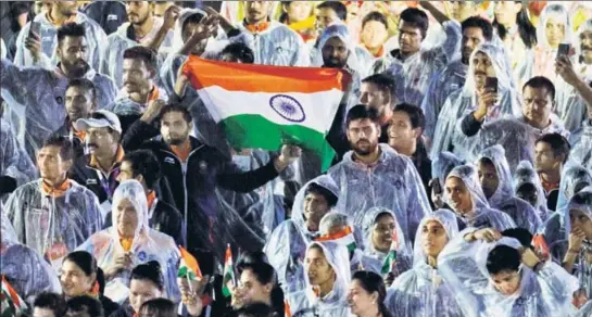  ?? AP ?? ■ Indian athletes march during the Asian Games closing ceremony at GBK Main Stadium in Jakarta on Sunday.
