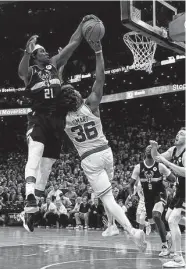  ?? Charles Krupa / Associated Press ?? The Bucks’ Jrue Holiday blocks a shot by the Celtics’ Marcus Smart in the final seconds Wednesday.