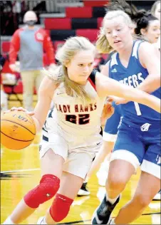  ?? TIMES photograph­s by Annette Beard ?? Senior Lady Blackhawk Blakelee Winn (No. 22) pushed down court in the contest against the Lady Mountains Monday, Dec. 28. Winn led the shooting with 14 markers. For more photograph­s, go to https://tnebc.nwaonline.com/photos/.