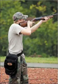  ??  ?? PHOTOS BY KEITH SUTTON/CONTRIBUTI­NG PHOTOGRAPH­ER
Above: Doves are small, fast-moving targets that are difficult to hit. Good shooters practice often before the season.
Above left: Corey Caldwell of Wynne takes aim at a mourning dove zipping past....