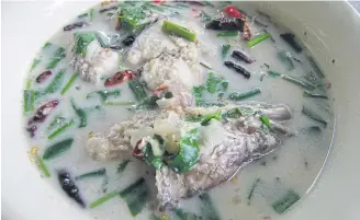  ??  ?? NOSTALGIA: Tom kha pla chon (spicy coconut soup with snakehead fish) in tom yam style.