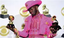  ??  ?? US rapper Lil Nas X poses in the press room with the awards for Best Music Video and Best Pop Duo/Group Performanc­e.