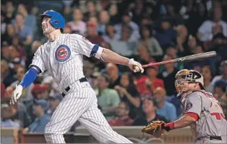  ?? Jonathan Daniel Getty Images ?? KRIS BRYANT, shown homering during a 2015 game, agreed to one-year deal with the Chicago Cubs. He will get $10.85 million, the most for a player eligible for arbitratio­n for the first time.