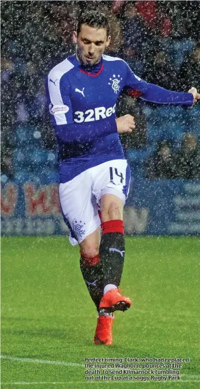  ??  ?? Perfect timing: Clark, who had replaced the injured Waghorn, pounces at the death to send Kilmarnock tumbling out of the Cup at a soggy Rugby Park