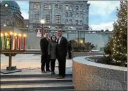  ?? PHOTO COURTESY OF MONTGOMERY COUNTY COMMISSION­ERS ?? Montgomery County Commission­ers Valerie Arkoosh, Kenneth Lawrence Jr. and Joseph Gale welcome the holidays with annual lighting of a Christmas tree, menorah and kinara on courthouse plaza.