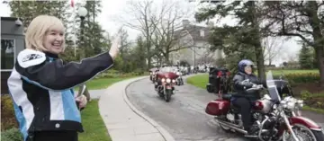  ??  ?? Mrs. Harper waves as members of the Motor Maids ride off from 24 Sussex Dr., the Prime Minister’s residence.