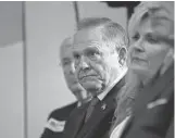  ?? BRYNN ANDERSON/ AP ?? U. S. Senate candidate Roy Moore, R- Ala., waits to speak at a news conference Thursday in Birmingham.