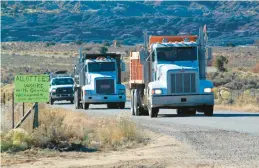  ?? SUSAN MONTOYA BRYAN/AP ?? Oilfield trucks drive along the road that leads toward Chaco Culture National Historical Park last year in northweste­rn New Mexico.