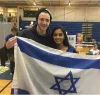  ?? (Courtesy Ariella Daniels) ?? A PRO-ISRAEL club has been formed by students at the University of Ontario Institute of Technology, shown here holding flags on campus.