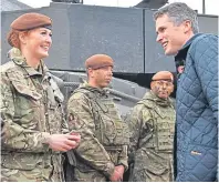  ??  ?? Gavin Williamson talks to Tank Gunner reservist Lance Corporal Cat Dixon, 28