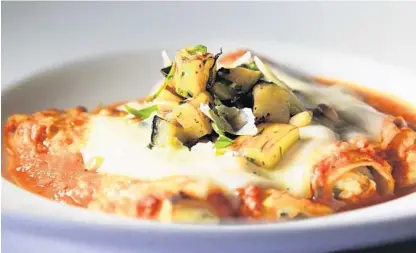  ?? CARLINE JEAN/STAFF PHOTOGRAPH­ER ?? The cannelloni at Timpano Italian Chophouse in Fort Lauderdale is a vegetarian-friendly dish, but still has a hearty appeal, especially when topped with an eggplant ragout.