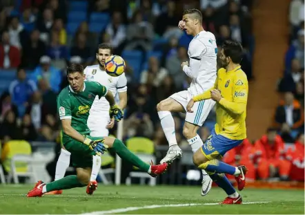  ??  ?? Dry spell: Real Madrid’s Cristiano Ronaldo (second from right) watching his shot go wide during the La Liga match against Las Palmas at the Bernabeu on Sunday. — AP