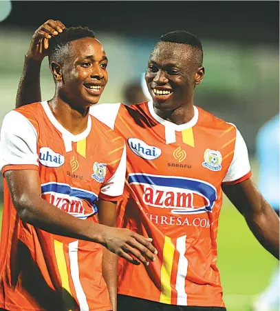  ??  ?? SMILING PRINCE. . . Zimbabwe internatio­nal forward, Prince Dube (left), who pulled out of the Warriors’ friendly match against Malawi saying he was nursing an injury, is congratula­ted by his teammate after scoring twice for his Tanzanian side Azam FC, in a friendly match yesterday