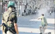  ?? WASEEM ANDRABI/HT ?? A policeman fires at protesters in Srinagar on Friday.