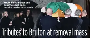  ?? ?? MASS Finola Burton and daughters look on as remains carried into church