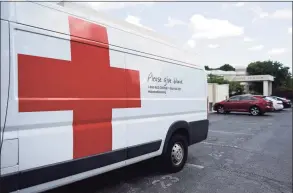  ?? Tyler Sizemore / Hearst Connecticu­t Media file photo ?? Vans are parked outside the American Red Cross blood drive at Temple Sholom in Greenwich, Monday, Aug. 2, 2021. Considerin­g COVID-19 precaution­s, blood donation appointmen­ts must now be booked in advance online, by calling 1-800-RED-CROSS, or using the American Red Cross app.
