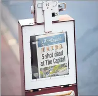  ?? PATRICK SEMANSKY — THE ASSOCIATED PRESS ?? A Capital Gazette newspaper rack displays the front page Friday in Annapolis, Md. Even after five members of its staff were killed by a gunman Thursday, the newspaper published Friday morning.