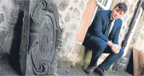  ?? Photograph by Kami Thomson ?? CONCERN: Councillor Michael Hutchison at Provost Skene House with the armorial panel left lying out.