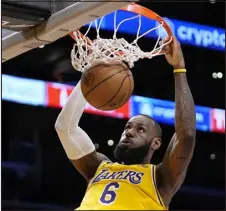  ?? MARK J. TERRILL — ASSOCIATED PRESS FILE PHOTO ?? Lakers forward Lebron James dunks during the first half of a game against the San Antonio Spurs on Jan. 25 in Los Angeles.