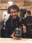  ??  ?? GIANLUCA VIBERTI, owner and wine maker of 460 Casina Bric with his magnum of Nebbiolo d’Alba Rose Brut Nature.