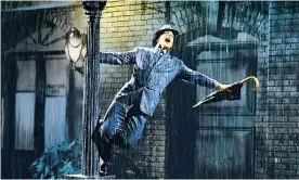  ?? Photograph: AF archive/Alamy ?? Gene Kelly in Singin’ in the Rain, a film so light on its feet as to make its genre-melding entertainm­ent look easy.