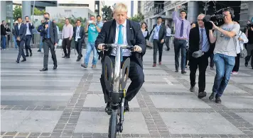  ??  ?? Boris Johnson rides an electric scooter in 2015. During his term as London mayor he championed the tech industry and start-ups