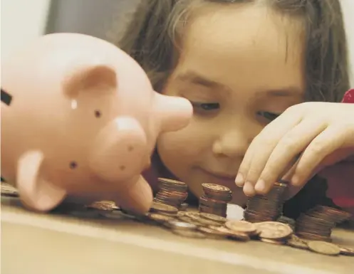  ??  ?? It’s never too early to get the cash out of the piggy bank and into a real one. For children under roughly age 18, an adult will need to open the account (with the child’s ID) and be a trustee or signatory on the account