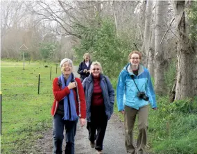  ?? ?? Above left: A group enjoying a walk on the trail. Photo FQG Above right: Friendly locals stop to chat on the suspension bridge.
Below right: The estuary by the river mouth.