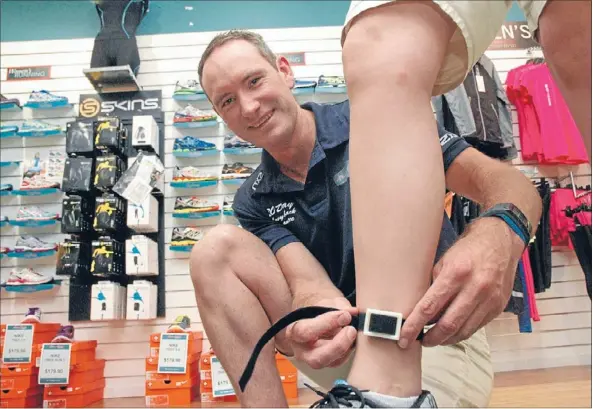  ?? Photo: KRIS DANDO ?? Cool runnings: Shoe Clinic manager Jeremy Boyd with the newly-developed sensor device that will measure impact on the tibia.