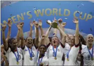  ?? ALESSANDRA TARANTINO - THE ASSOCIATED PRESS MARCIO JOSE SANCHEZ - THE ASSOCIATED PRESS ?? FILE - In this July 7, 2019, file photo, United States’ Megan Rapinoe lifts up a trophy after winning the Women’s World Cup final soccer match between U.S. and The Netherland­s at the Stade de Lyon in Decines, outside Lyon, France. “We’ve done exactly what we set out to do, done exactly what we wanted to do, said what we feel,” said Rapinoe. “I know sometimes my voice is louder, but everybody is in this together.”
FILE - In this July 12, 2019, file photo, members of the Los Angeles Angels observe a moment of silence for teammate Tyler Skaggs before the team’s baseball game against the Seattle Mariners, in Anaheim, Calif. The sudden death of popular Los Angeles Angels left-hander Skaggs in early July rocked the baseball world.