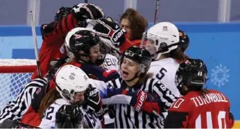  ?? MADDIE MEYER/GETTY IMAGES ?? The Canada-U.S. game ended in a scrum in front of the Canadian net, as the Americans attacked in waves.