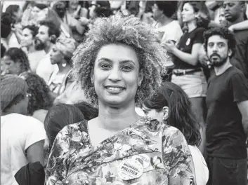  ?? CITY COUNCILWOM­AN Ellis Rua Associated Press ?? Marielle Franco’s 2018 slaying shook Brazil. A federal report sheds light on her assassinat­ion and the extent of corruption in Rio de Janeiro, where militias allegedly pay police to look away.