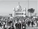  ?? K.M. Chaudary / Associated Press ?? Sikh pilgrims visit the shrine of their spiritual leader, Guru Nanak, at Gurdwara Darbar Sahib in Pakistan.