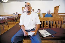  ?? LUIS SÁNCHEZ SATURNO/THE NEW MEXICAN ?? Sixto Aguirre, a peer mentor with Barrios Unidos in Chimayó, waits for a defendant Tuesday in Judge Jason Lidyard’s Tierra Amarilla courtroom. When Aguirre appeared over a year ago in front of Lidyard on a DWI charge, the judge put him on electronic monitoring instead of sending him to jail because he knew Aguirre was pursuing certificat­ion as a peer counselor. Now sober, Aguirre provides support to people struggling with addiction.