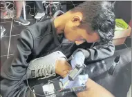  ??  ?? Muscular Dystrophy hasn’t stood in the way of tattoo artist Macalister Dalton Govindsamy