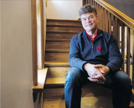  ?? BRANDON HARDER ?? Edward Willett, shown in his Regina home, has published a book about his wife’s grandfathe­r, veteran Sampson Goodfellow.